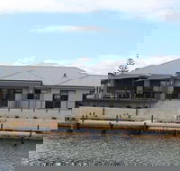 Port Bouvard Retreat - Large Family Friendly Canal Home with Private Jetty - Accommodation Gold Coast